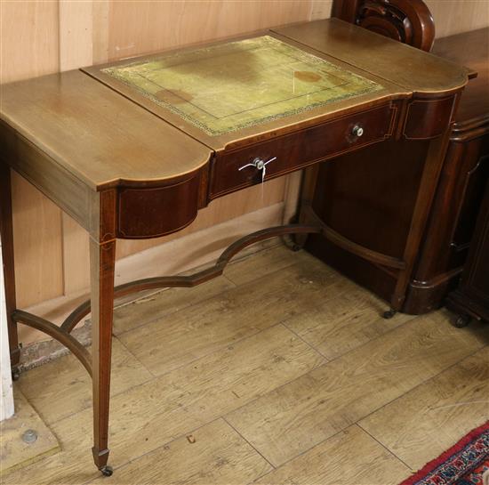 An Edwardian mahogany writing table, W.107cm